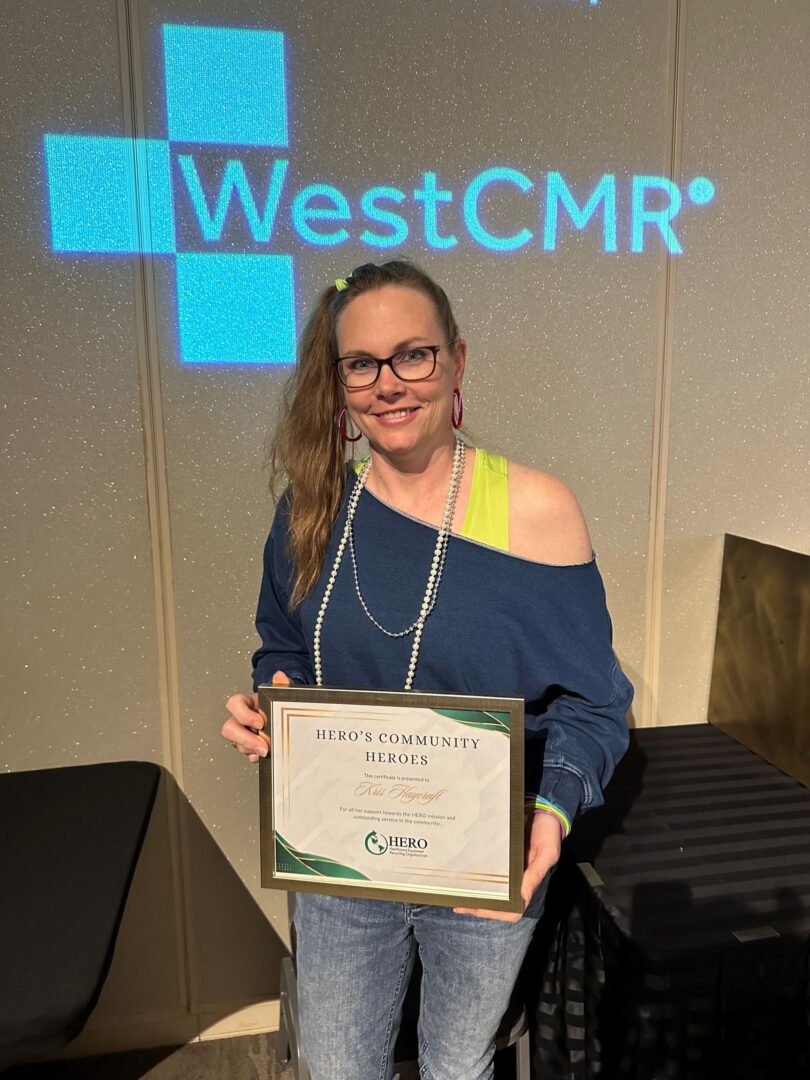 Woman holding award certificate